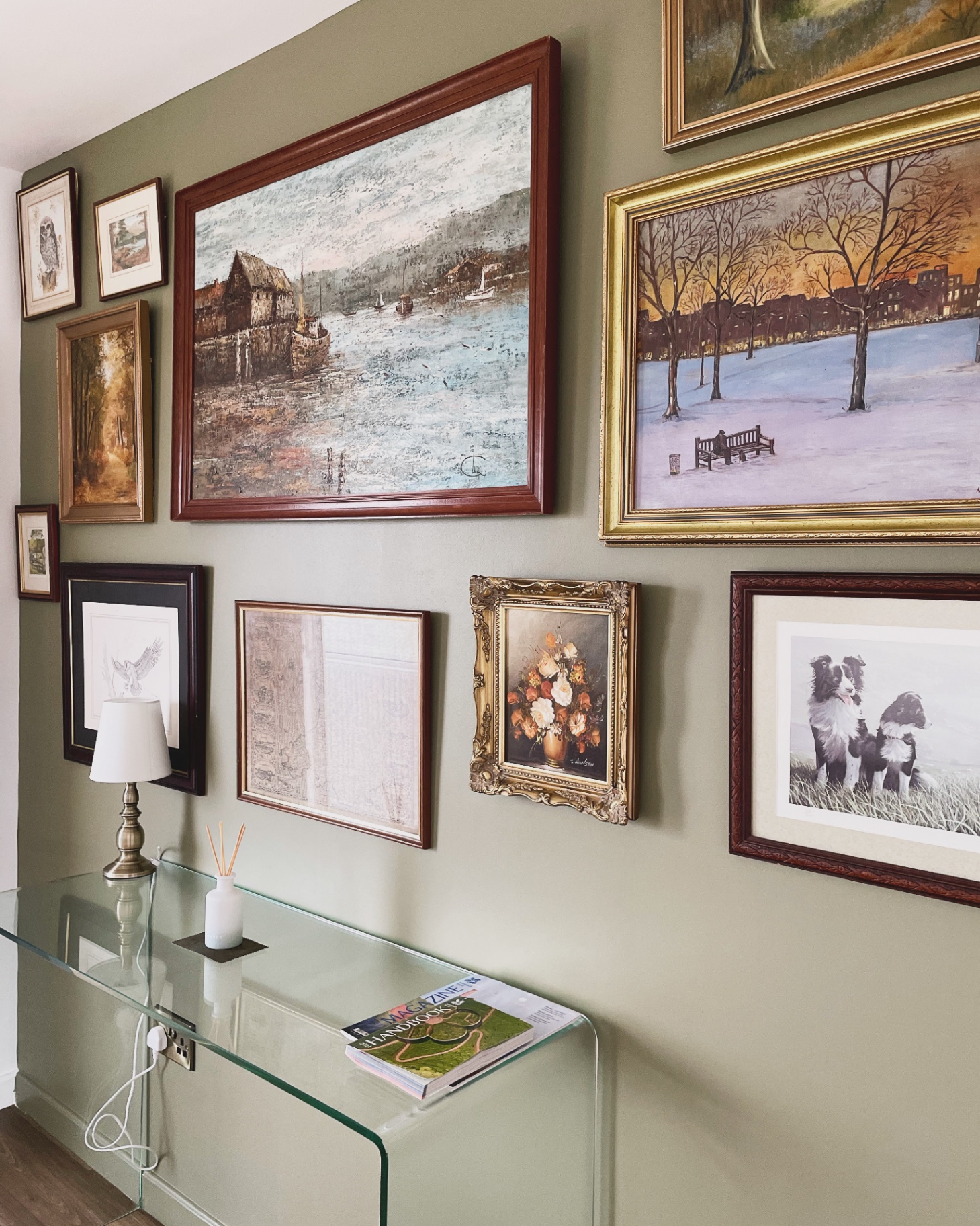 Framed paintings on the gallery wall at Ty Ray Penmaes