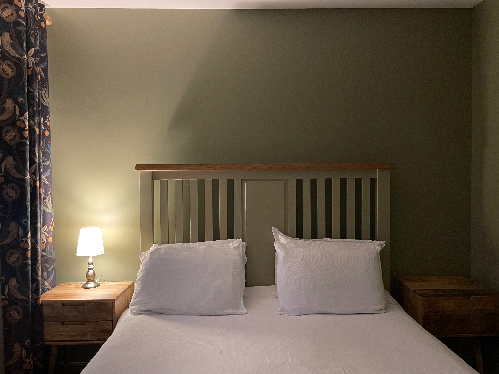Bedside, lamps on at Ty Ray Penmaes